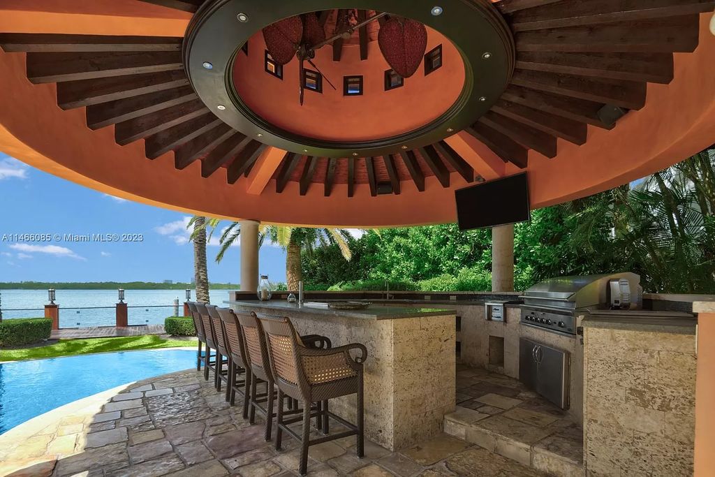 Experience the epitome of Mediterranean luxury at 230 Bal Bay Dr, an exclusive waterfront estate in Bal Harbour Village. Crafted by the esteemed Alexander Group, this custom-built masterpiece boasts exquisite details like custom millwork, Jerusalem stone flooring, and marble accents throughout.