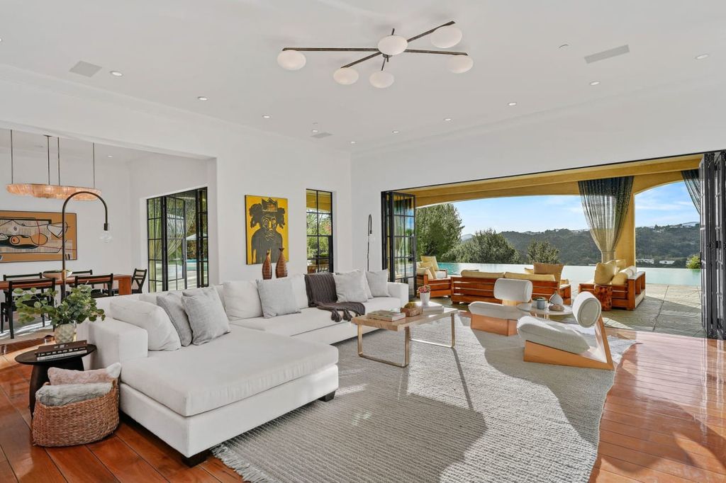 2505 Summitridge Drive Home in Beverly Hills, California, Discover the epitome of luxury living in this custom 9-bedroom, 11-bathroom estate nestled within the exclusive Bella Vista community in Beverly Hills. Boasting sophisticated amenities such as a private park, basketball court, and unobstructed canyon views, this residence seamlessly blends old-world Italian charm with modern technology.
