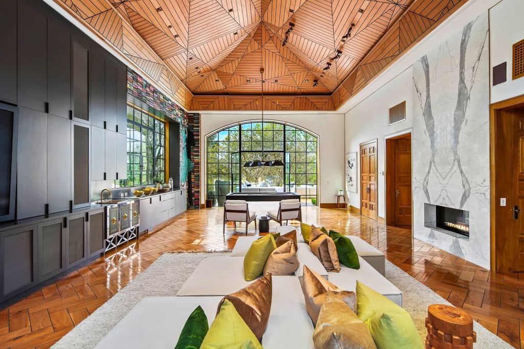 2505 Summitridge Drive Home in Beverly Hills, California, Discover the epitome of luxury living in this custom 9-bedroom, 11-bathroom estate nestled within the exclusive Bella Vista community in Beverly Hills. Boasting sophisticated amenities such as a private park, basketball court, and unobstructed canyon views, this residence seamlessly blends old-world Italian charm with modern technology.