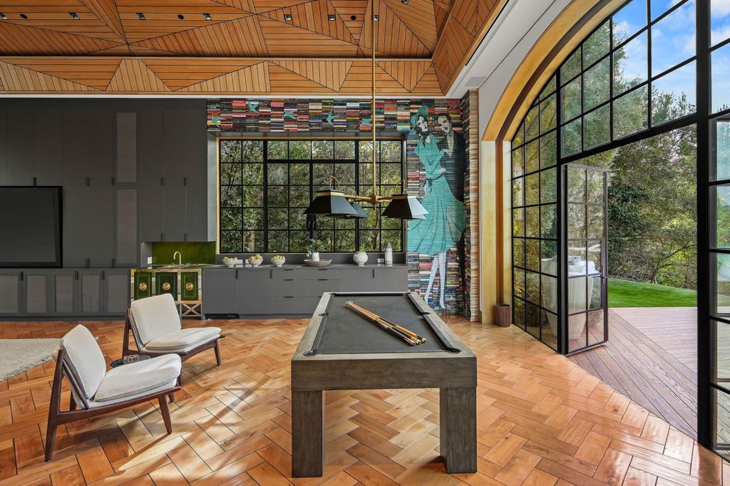 2505 Summitridge Drive Home in Beverly Hills, California, Discover the epitome of luxury living in this custom 9-bedroom, 11-bathroom estate nestled within the exclusive Bella Vista community in Beverly Hills. Boasting sophisticated amenities such as a private park, basketball court, and unobstructed canyon views, this residence seamlessly blends old-world Italian charm with modern technology.