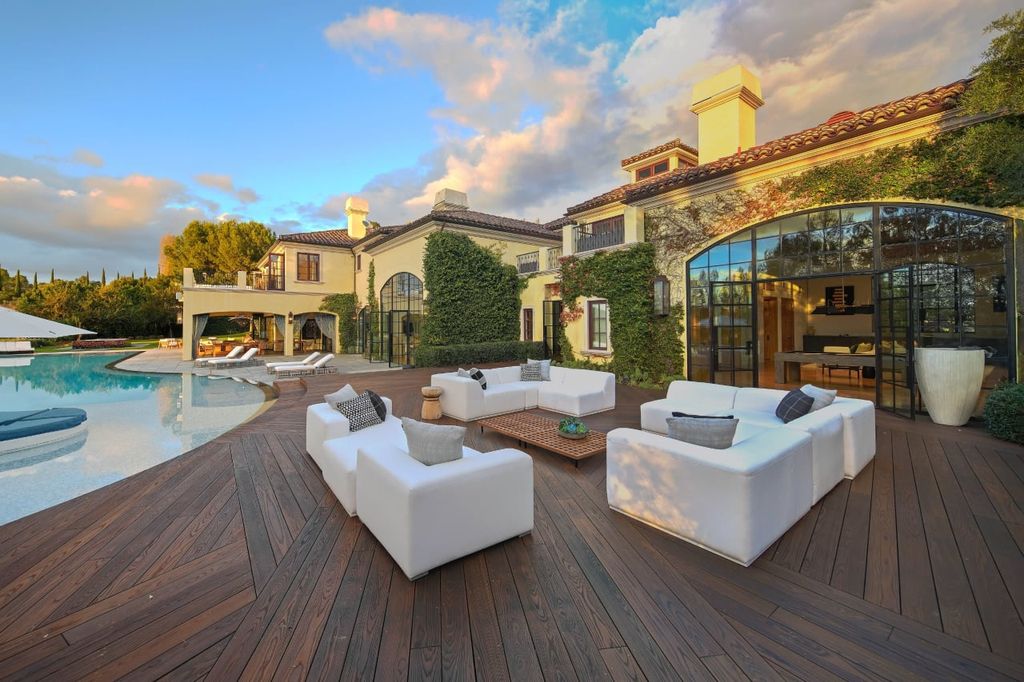 2505 Summitridge Drive Home in Beverly Hills, California, Discover the epitome of luxury living in this custom 9-bedroom, 11-bathroom estate nestled within the exclusive Bella Vista community in Beverly Hills. Boasting sophisticated amenities such as a private park, basketball court, and unobstructed canyon views, this residence seamlessly blends old-world Italian charm with modern technology.