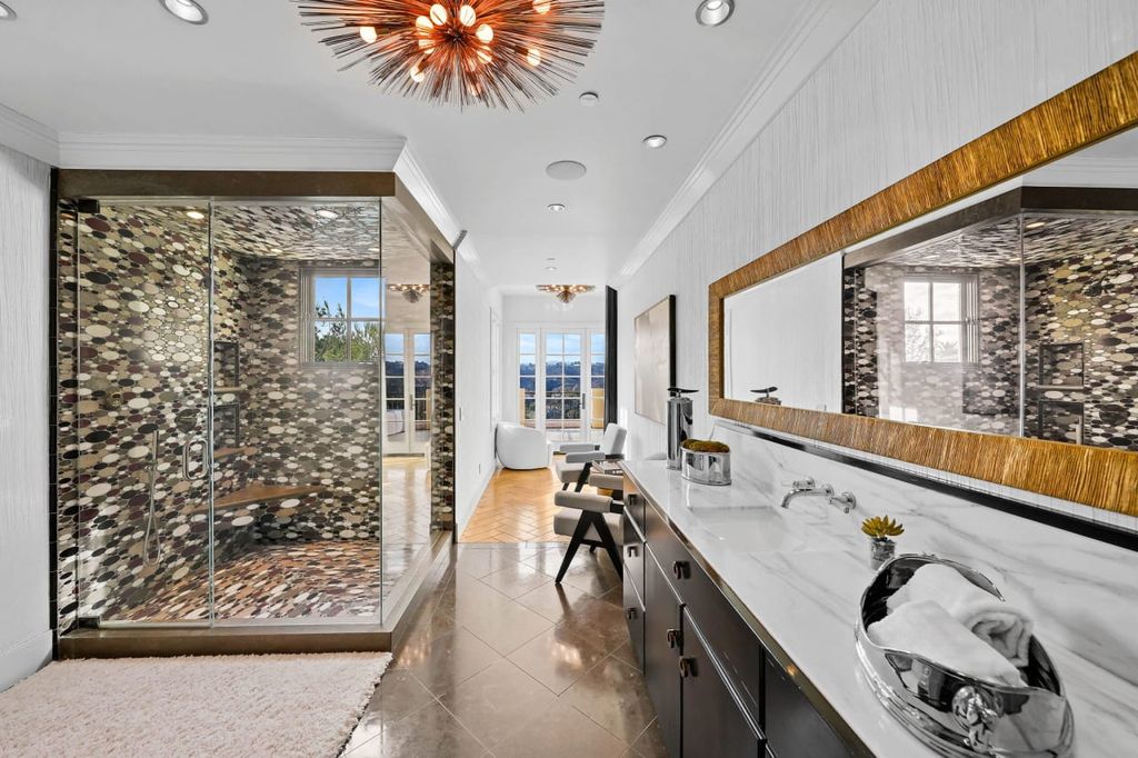 2505 Summitridge Drive Home in Beverly Hills, California, Discover the epitome of luxury living in this custom 9-bedroom, 11-bathroom estate nestled within the exclusive Bella Vista community in Beverly Hills. Boasting sophisticated amenities such as a private park, basketball court, and unobstructed canyon views, this residence seamlessly blends old-world Italian charm with modern technology.