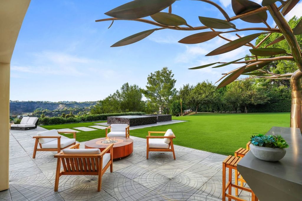 2505 Summitridge Drive Home in Beverly Hills, California, Discover the epitome of luxury living in this custom 9-bedroom, 11-bathroom estate nestled within the exclusive Bella Vista community in Beverly Hills. Boasting sophisticated amenities such as a private park, basketball court, and unobstructed canyon views, this residence seamlessly blends old-world Italian charm with modern technology.