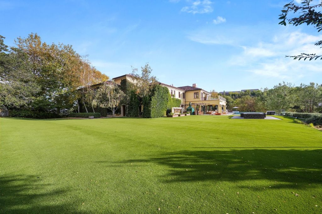 2505 Summitridge Drive Home in Beverly Hills, California, Discover the epitome of luxury living in this custom 9-bedroom, 11-bathroom estate nestled within the exclusive Bella Vista community in Beverly Hills. Boasting sophisticated amenities such as a private park, basketball court, and unobstructed canyon views, this residence seamlessly blends old-world Italian charm with modern technology.
