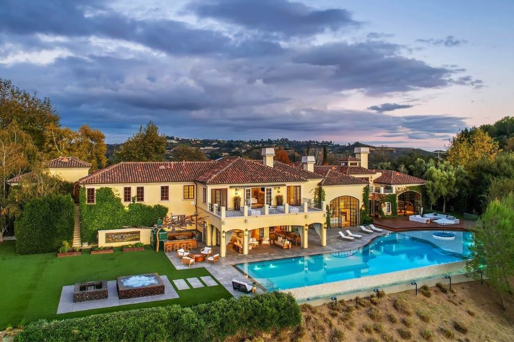 2505 Summitridge Drive Home in Beverly Hills, California, Discover the epitome of luxury living in this custom 9-bedroom, 11-bathroom estate nestled within the exclusive Bella Vista community in Beverly Hills. Boasting sophisticated amenities such as a private park, basketball court, and unobstructed canyon views, this residence seamlessly blends old-world Italian charm with modern technology.
