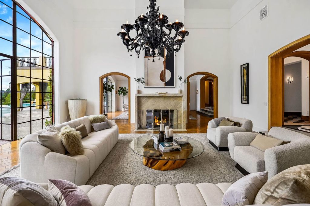 2505 Summitridge Drive Home in Beverly Hills, California, Discover the epitome of luxury living in this custom 9-bedroom, 11-bathroom estate nestled within the exclusive Bella Vista community in Beverly Hills. Boasting sophisticated amenities such as a private park, basketball court, and unobstructed canyon views, this residence seamlessly blends old-world Italian charm with modern technology.