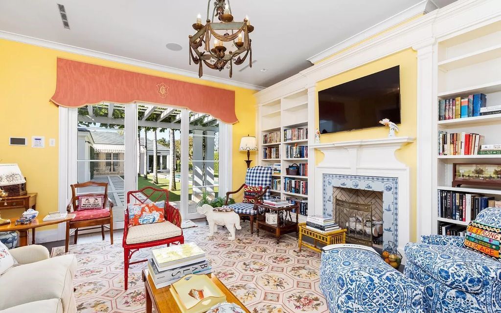 Nestled in Palm Beach's prestigious Estate Section, this 1.3+/- acre property epitomizes luxury living with a stunning clay tennis court, two guest houses, and immaculate grounds. A gated entry leads to a circular drive and ample parking, complemented by a separate service area and a 2-car garage.