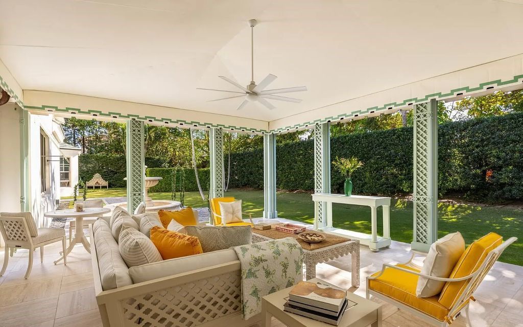 Nestled in Palm Beach's prestigious Estate Section, this 1.3+/- acre property epitomizes luxury living with a stunning clay tennis court, two guest houses, and immaculate grounds. A gated entry leads to a circular drive and ample parking, complemented by a separate service area and a 2-car garage.