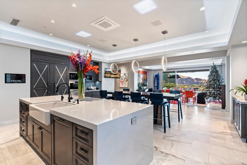 6850 North 39th Place Home in Paradise Valley, Arizona. Indulge in the epitome of luxury living with this exquisite hillside estate offering breathtaking city lights and Camelback Mountain views. Situated on just under 2.2 acres inside the guard-gated Paradise Reserve community, this newly crafted custom home seamlessly integrates indoor and outdoor spaces. 