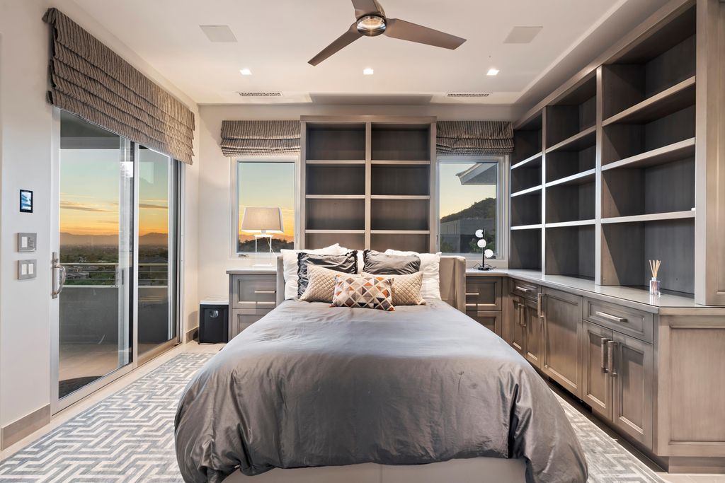 6850 North 39th Place Home in Paradise Valley, Arizona. Indulge in the epitome of luxury living with this exquisite hillside estate offering breathtaking city lights and Camelback Mountain views. Situated on just under 2.2 acres inside the guard-gated Paradise Reserve community, this newly crafted custom home seamlessly integrates indoor and outdoor spaces. 