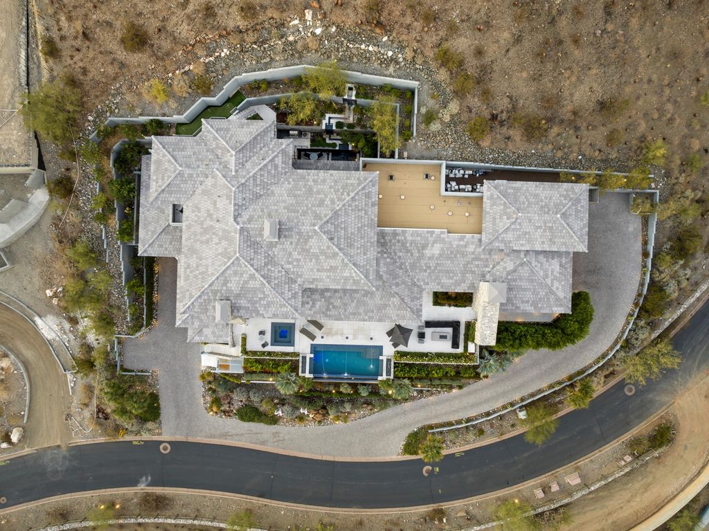 6850 North 39th Place Home in Paradise Valley, Arizona. Indulge in the epitome of luxury living with this exquisite hillside estate offering breathtaking city lights and Camelback Mountain views. Situated on just under 2.2 acres inside the guard-gated Paradise Reserve community, this newly crafted custom home seamlessly integrates indoor and outdoor spaces. 