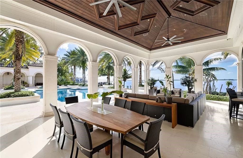 Indulge in the pinnacle of luxury at this Palladian-inspired Grand Estate in Fort Myers. Sprawling across 2 waterfront acres, this 19,184 square feet masterpiece boasts 4 bedrooms, 2 dens, a private cinema, and a 2,000-bottle wine cellar in the main residence, with an additional 3 bedrooms in the guest house.