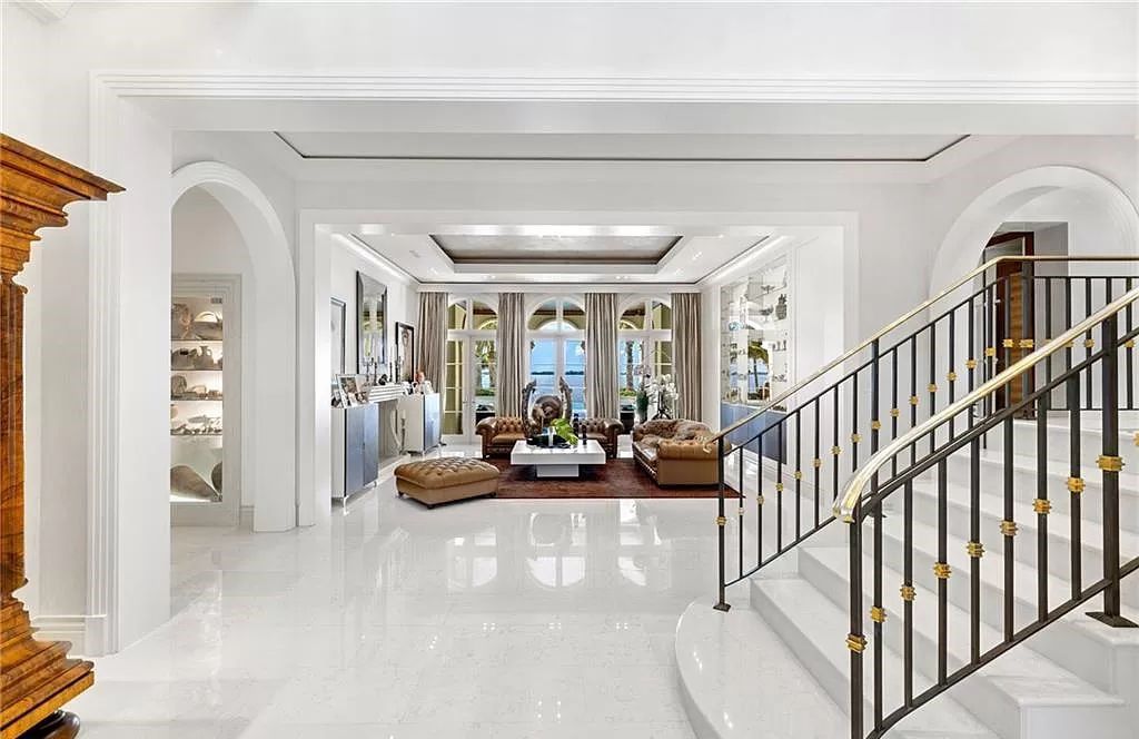 Indulge in the pinnacle of luxury at this Palladian-inspired Grand Estate in Fort Myers. Sprawling across 2 waterfront acres, this 19,184 square feet masterpiece boasts 4 bedrooms, 2 dens, a private cinema, and a 2,000-bottle wine cellar in the main residence, with an additional 3 bedrooms in the guest house.