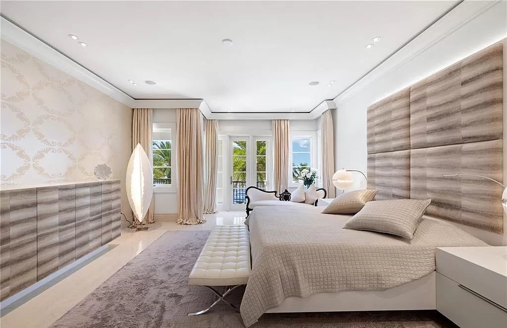 Indulge in the pinnacle of luxury at this Palladian-inspired Grand Estate in Fort Myers. Sprawling across 2 waterfront acres, this 19,184 square feet masterpiece boasts 4 bedrooms, 2 dens, a private cinema, and a 2,000-bottle wine cellar in the main residence, with an additional 3 bedrooms in the guest house.