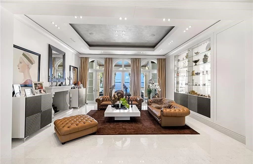 Indulge in the pinnacle of luxury at this Palladian-inspired Grand Estate in Fort Myers. Sprawling across 2 waterfront acres, this 19,184 square feet masterpiece boasts 4 bedrooms, 2 dens, a private cinema, and a 2,000-bottle wine cellar in the main residence, with an additional 3 bedrooms in the guest house.