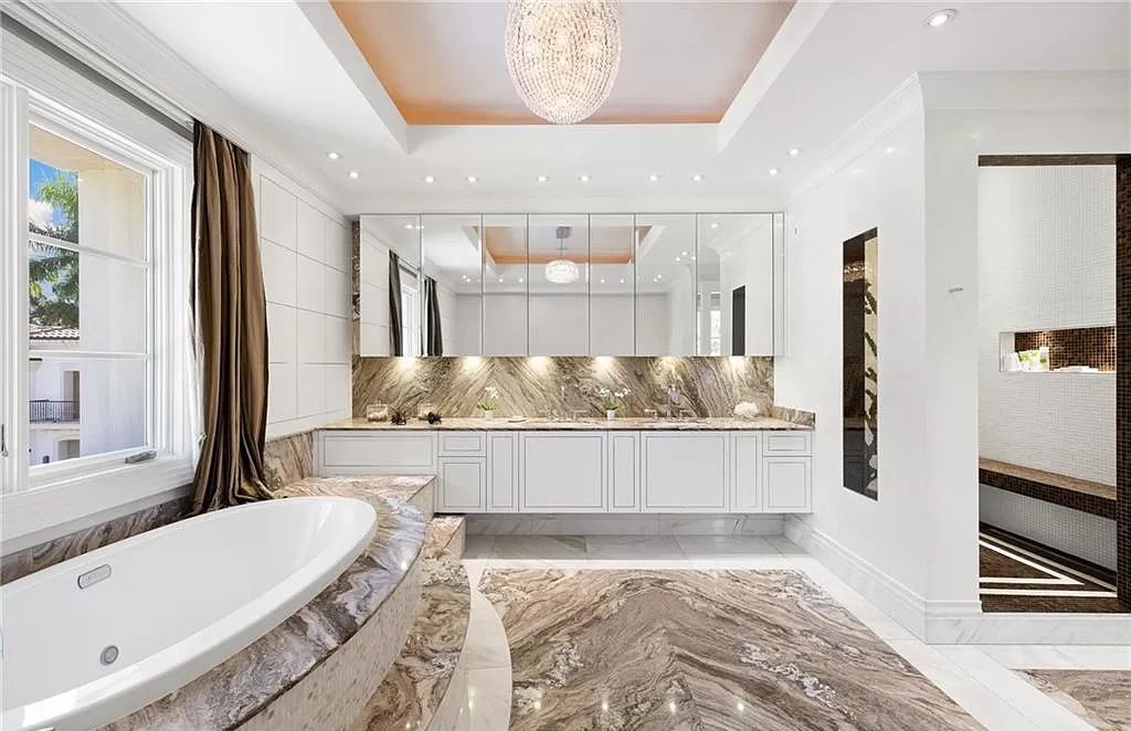 Indulge in the pinnacle of luxury at this Palladian-inspired Grand Estate in Fort Myers. Sprawling across 2 waterfront acres, this 19,184 square feet masterpiece boasts 4 bedrooms, 2 dens, a private cinema, and a 2,000-bottle wine cellar in the main residence, with an additional 3 bedrooms in the guest house.