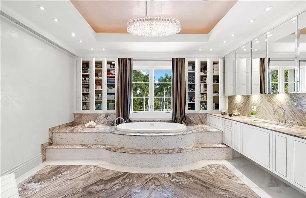 Indulge in the pinnacle of luxury at this Palladian-inspired Grand Estate in Fort Myers. Sprawling across 2 waterfront acres, this 19,184 square feet masterpiece boasts 4 bedrooms, 2 dens, a private cinema, and a 2,000-bottle wine cellar in the main residence, with an additional 3 bedrooms in the guest house.