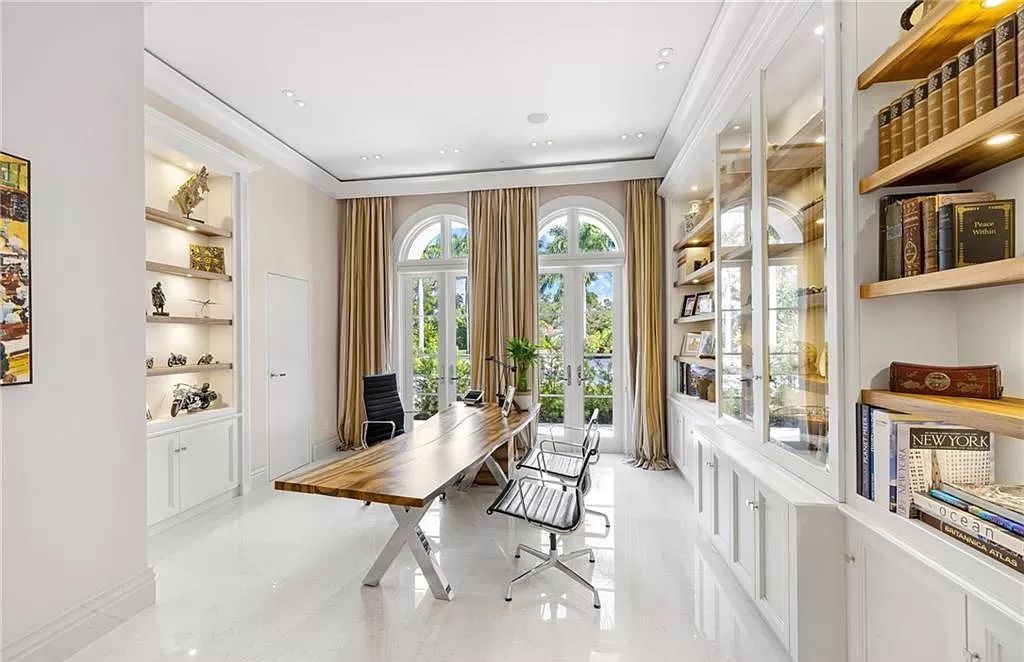 Indulge in the pinnacle of luxury at this Palladian-inspired Grand Estate in Fort Myers. Sprawling across 2 waterfront acres, this 19,184 square feet masterpiece boasts 4 bedrooms, 2 dens, a private cinema, and a 2,000-bottle wine cellar in the main residence, with an additional 3 bedrooms in the guest house.