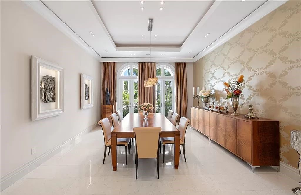 Indulge in the pinnacle of luxury at this Palladian-inspired Grand Estate in Fort Myers. Sprawling across 2 waterfront acres, this 19,184 square feet masterpiece boasts 4 bedrooms, 2 dens, a private cinema, and a 2,000-bottle wine cellar in the main residence, with an additional 3 bedrooms in the guest house.