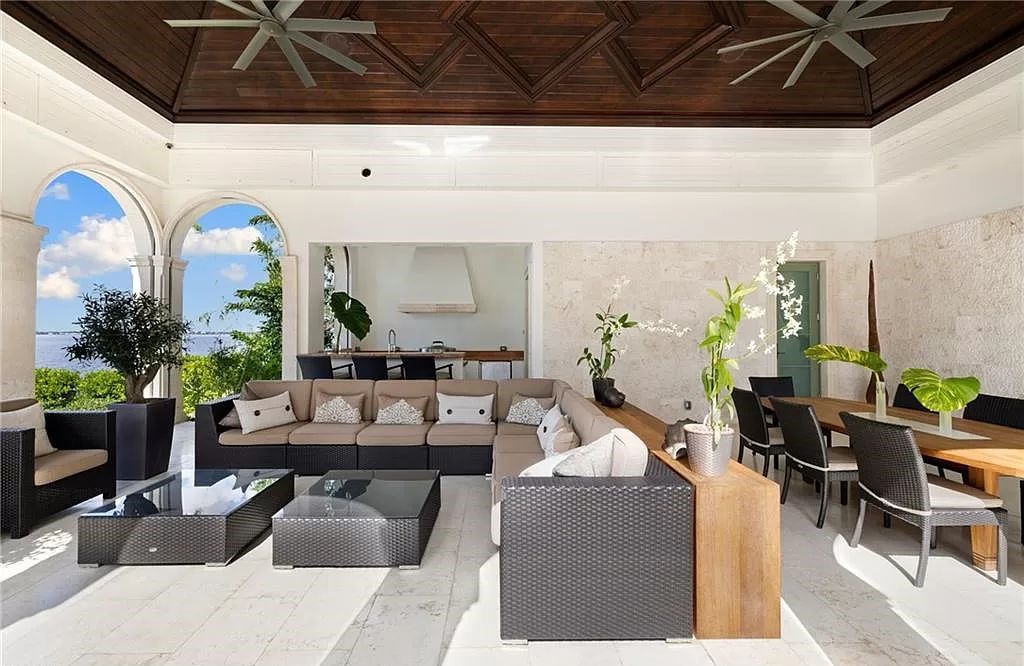 Indulge in the pinnacle of luxury at this Palladian-inspired Grand Estate in Fort Myers. Sprawling across 2 waterfront acres, this 19,184 square feet masterpiece boasts 4 bedrooms, 2 dens, a private cinema, and a 2,000-bottle wine cellar in the main residence, with an additional 3 bedrooms in the guest house.