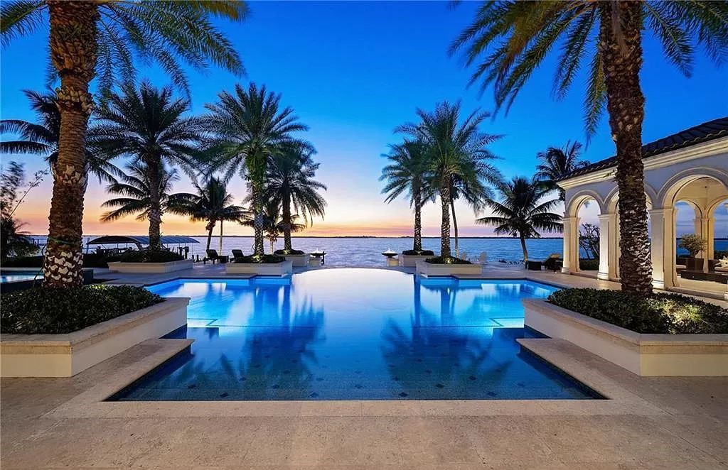 Indulge in the pinnacle of luxury at this Palladian-inspired Grand Estate in Fort Myers. Sprawling across 2 waterfront acres, this 19,184 square feet masterpiece boasts 4 bedrooms, 2 dens, a private cinema, and a 2,000-bottle wine cellar in the main residence, with an additional 3 bedrooms in the guest house.