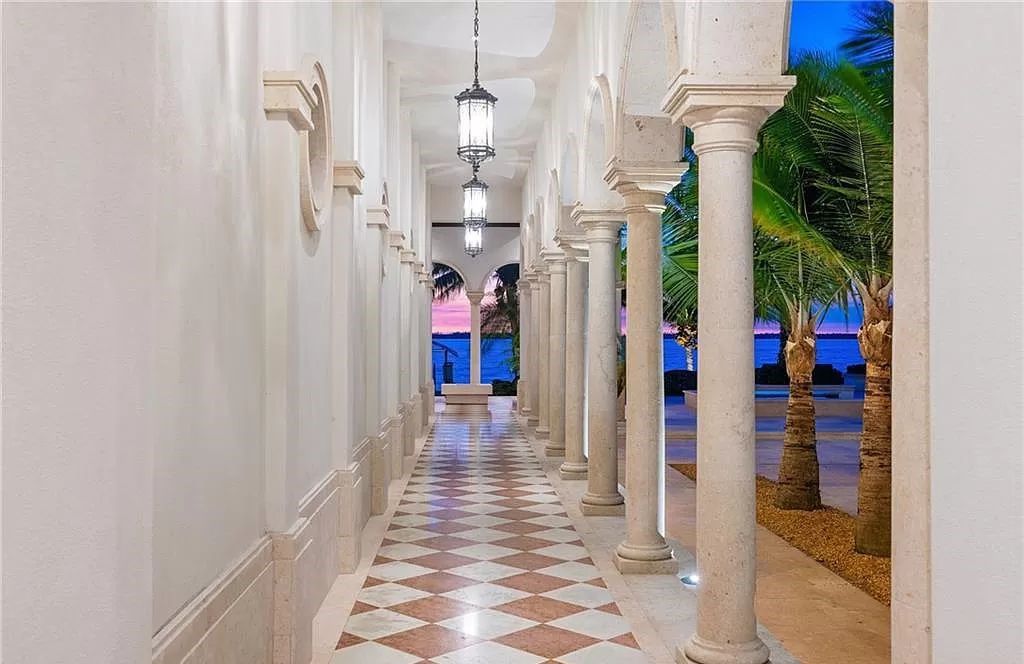 Indulge in the pinnacle of luxury at this Palladian-inspired Grand Estate in Fort Myers. Sprawling across 2 waterfront acres, this 19,184 square feet masterpiece boasts 4 bedrooms, 2 dens, a private cinema, and a 2,000-bottle wine cellar in the main residence, with an additional 3 bedrooms in the guest house.