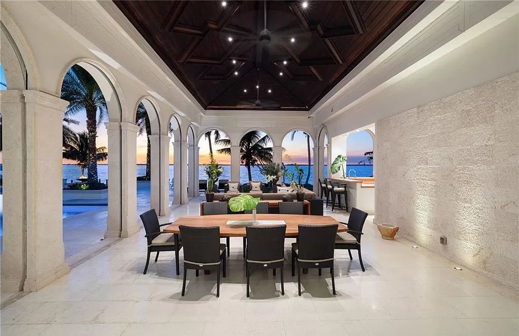 Indulge in the pinnacle of luxury at this Palladian-inspired Grand Estate in Fort Myers. Sprawling across 2 waterfront acres, this 19,184 square feet masterpiece boasts 4 bedrooms, 2 dens, a private cinema, and a 2,000-bottle wine cellar in the main residence, with an additional 3 bedrooms in the guest house.