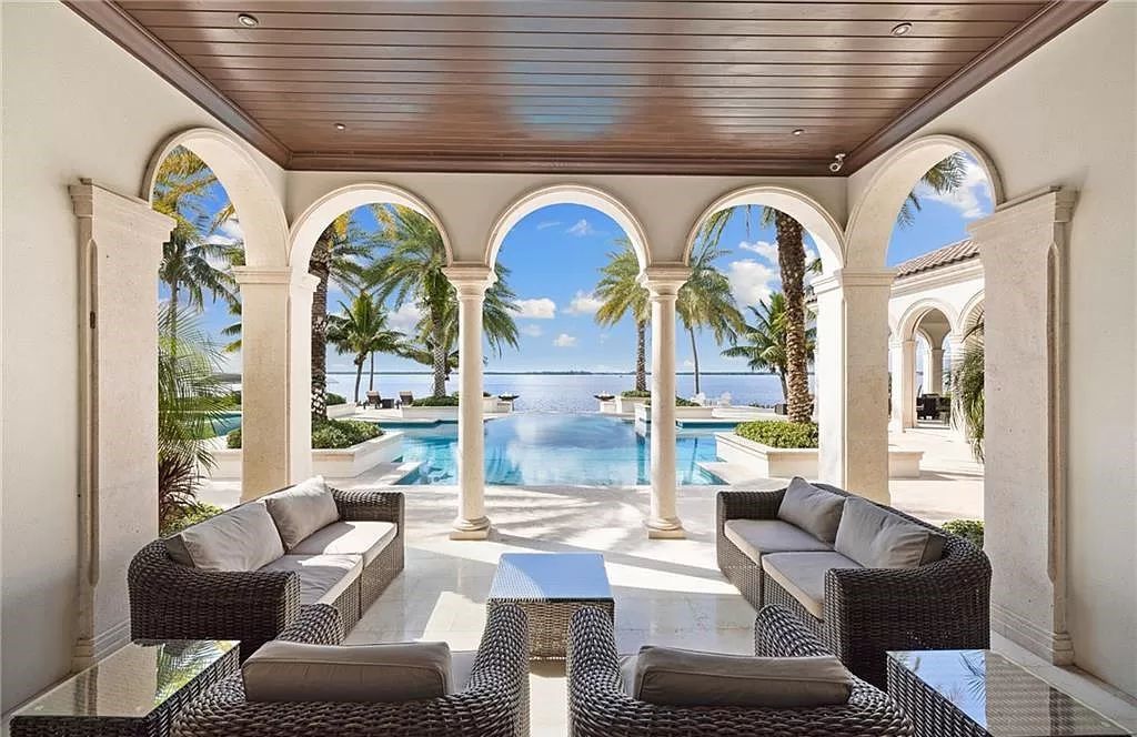 Indulge in the pinnacle of luxury at this Palladian-inspired Grand Estate in Fort Myers. Sprawling across 2 waterfront acres, this 19,184 square feet masterpiece boasts 4 bedrooms, 2 dens, a private cinema, and a 2,000-bottle wine cellar in the main residence, with an additional 3 bedrooms in the guest house.