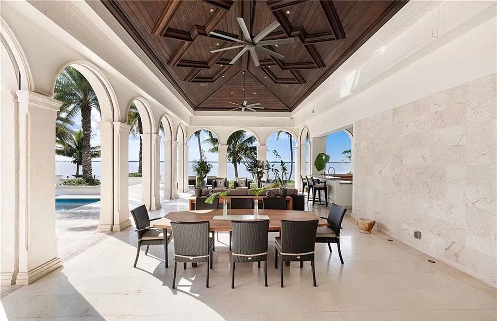 Indulge in the pinnacle of luxury at this Palladian-inspired Grand Estate in Fort Myers. Sprawling across 2 waterfront acres, this 19,184 square feet masterpiece boasts 4 bedrooms, 2 dens, a private cinema, and a 2,000-bottle wine cellar in the main residence, with an additional 3 bedrooms in the guest house.