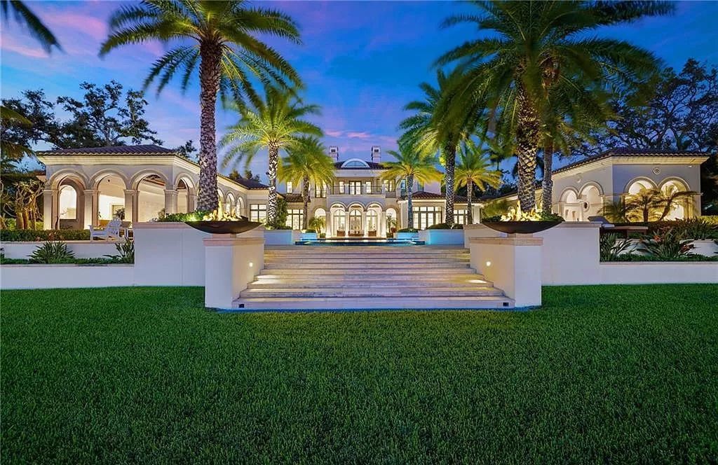 Indulge in the pinnacle of luxury at this Palladian-inspired Grand Estate in Fort Myers. Sprawling across 2 waterfront acres, this 19,184 square feet masterpiece boasts 4 bedrooms, 2 dens, a private cinema, and a 2,000-bottle wine cellar in the main residence, with an additional 3 bedrooms in the guest house.