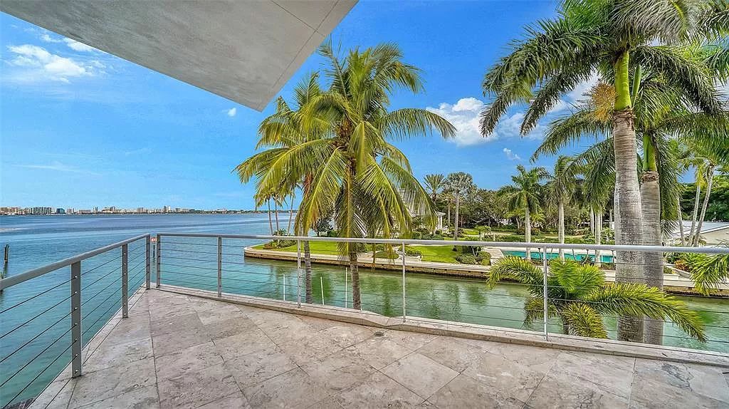 This award-winning Carl Abbott residence in Sarasota epitomizes luxury living with breathtaking bay and city skyline views. Designed to maximize natural light, the home exudes elegance and seamless integration with its surroundings.