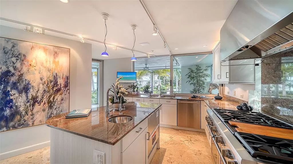 This award-winning Carl Abbott residence in Sarasota epitomizes luxury living with breathtaking bay and city skyline views. Designed to maximize natural light, the home exudes elegance and seamless integration with its surroundings.