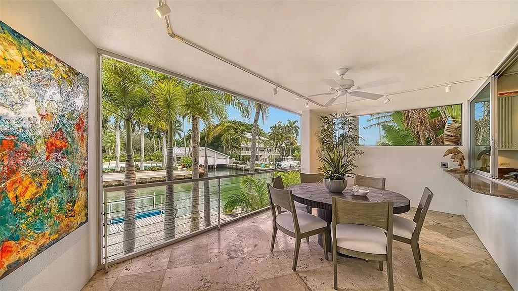 This award-winning Carl Abbott residence in Sarasota epitomizes luxury living with breathtaking bay and city skyline views. Designed to maximize natural light, the home exudes elegance and seamless integration with its surroundings.