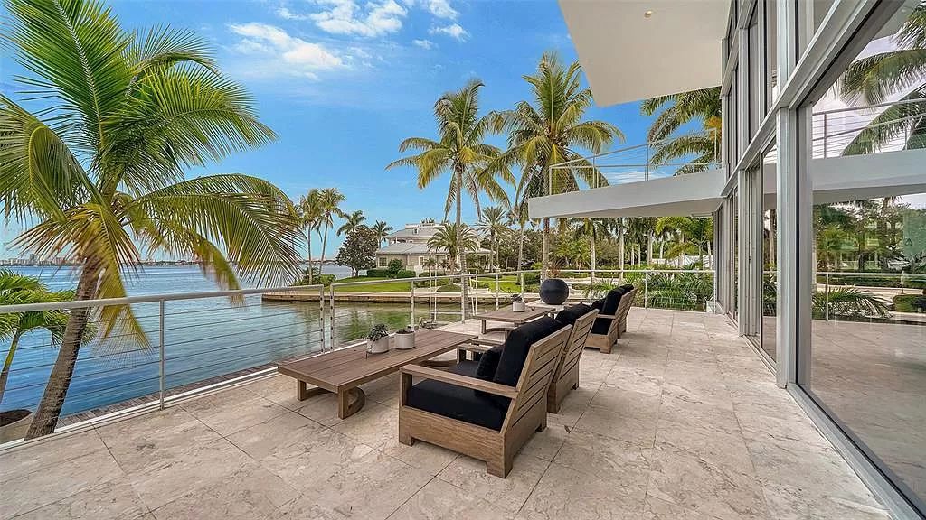 This award-winning Carl Abbott residence in Sarasota epitomizes luxury living with breathtaking bay and city skyline views. Designed to maximize natural light, the home exudes elegance and seamless integration with its surroundings.