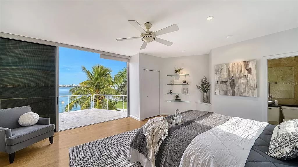 This award-winning Carl Abbott residence in Sarasota epitomizes luxury living with breathtaking bay and city skyline views. Designed to maximize natural light, the home exudes elegance and seamless integration with its surroundings.