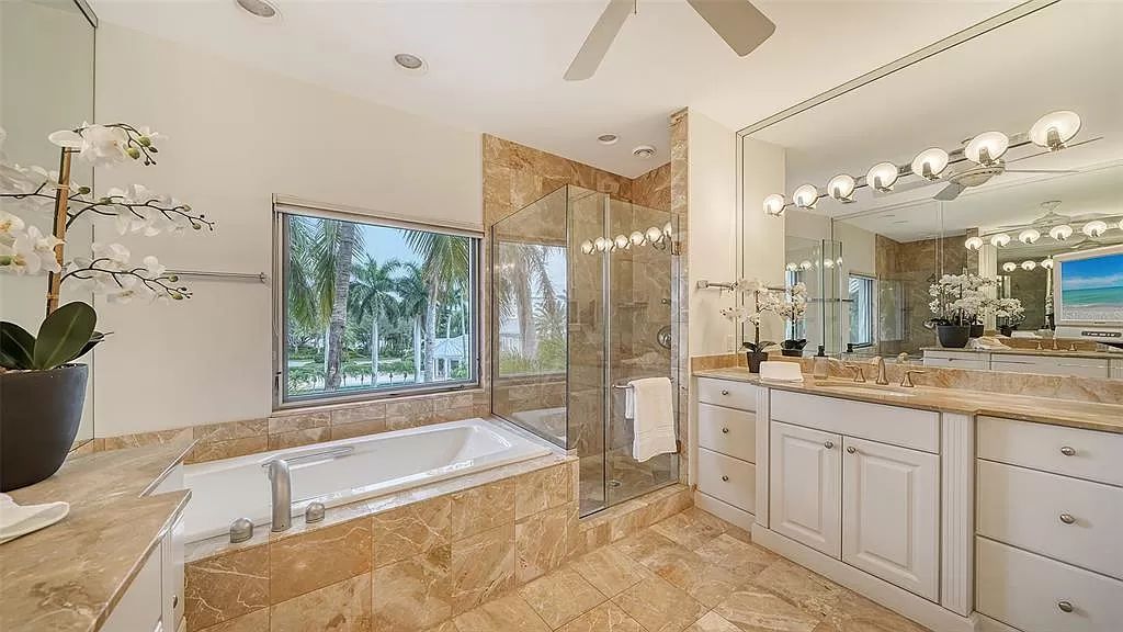 This award-winning Carl Abbott residence in Sarasota epitomizes luxury living with breathtaking bay and city skyline views. Designed to maximize natural light, the home exudes elegance and seamless integration with its surroundings.