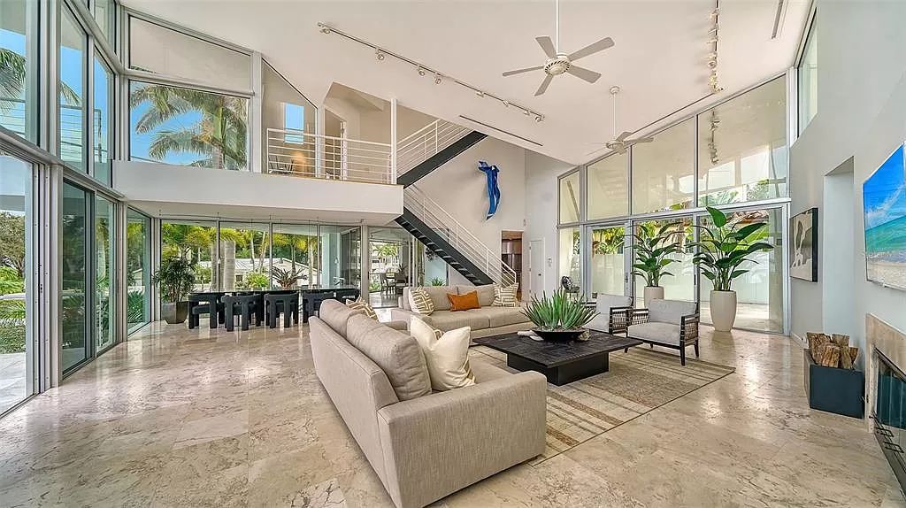 This award-winning Carl Abbott residence in Sarasota epitomizes luxury living with breathtaking bay and city skyline views. Designed to maximize natural light, the home exudes elegance and seamless integration with its surroundings.
