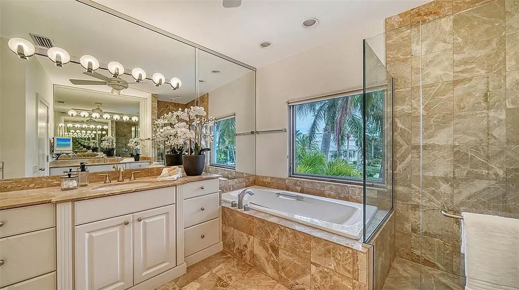 This award-winning Carl Abbott residence in Sarasota epitomizes luxury living with breathtaking bay and city skyline views. Designed to maximize natural light, the home exudes elegance and seamless integration with its surroundings.
