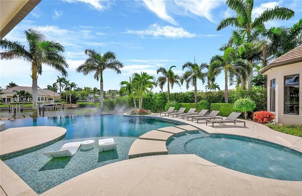 Discover an unparalleled oasis in Naples, Florida's esteemed Port Royal Community at 850 Nelsons Walk. This meticulously crafted estate seamlessly intertwines indoor and outdoor spaces, offering an entertainer's dream with an infinity-edge pool, outdoor kitchen, wine cellar, and more.
