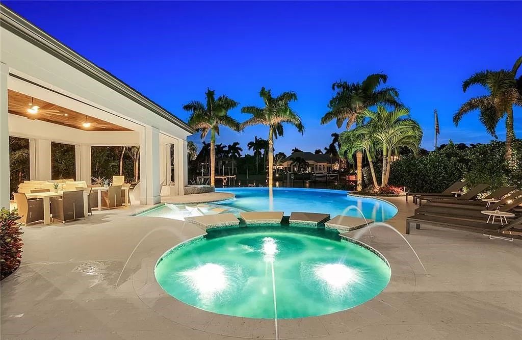 Discover an unparalleled oasis in Naples, Florida's esteemed Port Royal Community at 850 Nelsons Walk. This meticulously crafted estate seamlessly intertwines indoor and outdoor spaces, offering an entertainer's dream with an infinity-edge pool, outdoor kitchen, wine cellar, and more.