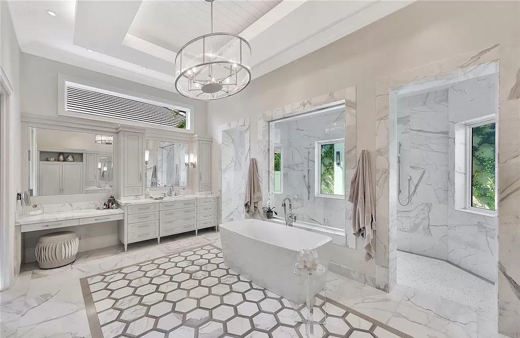 Discover an unparalleled oasis in Naples, Florida's esteemed Port Royal Community at 850 Nelsons Walk. This meticulously crafted estate seamlessly intertwines indoor and outdoor spaces, offering an entertainer's dream with an infinity-edge pool, outdoor kitchen, wine cellar, and more.