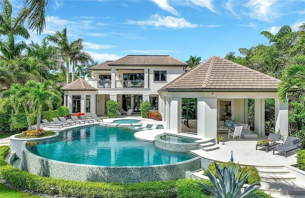 Discover an unparalleled oasis in Naples, Florida's esteemed Port Royal Community at 850 Nelsons Walk. This meticulously crafted estate seamlessly intertwines indoor and outdoor spaces, offering an entertainer's dream with an infinity-edge pool, outdoor kitchen, wine cellar, and more.