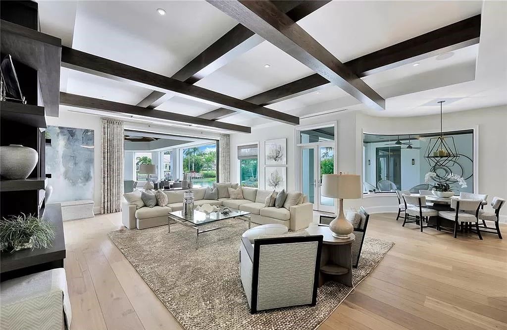 Discover an unparalleled oasis in Naples, Florida's esteemed Port Royal Community at 850 Nelsons Walk. This meticulously crafted estate seamlessly intertwines indoor and outdoor spaces, offering an entertainer's dream with an infinity-edge pool, outdoor kitchen, wine cellar, and more.