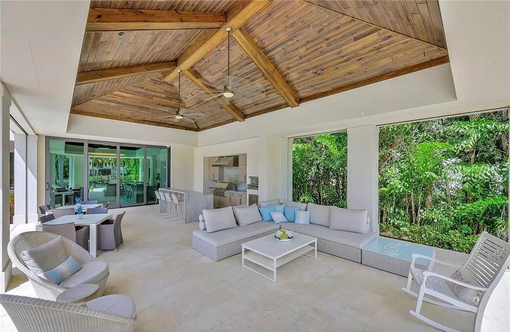 Discover an unparalleled oasis in Naples, Florida's esteemed Port Royal Community at 850 Nelsons Walk. This meticulously crafted estate seamlessly intertwines indoor and outdoor spaces, offering an entertainer's dream with an infinity-edge pool, outdoor kitchen, wine cellar, and more.