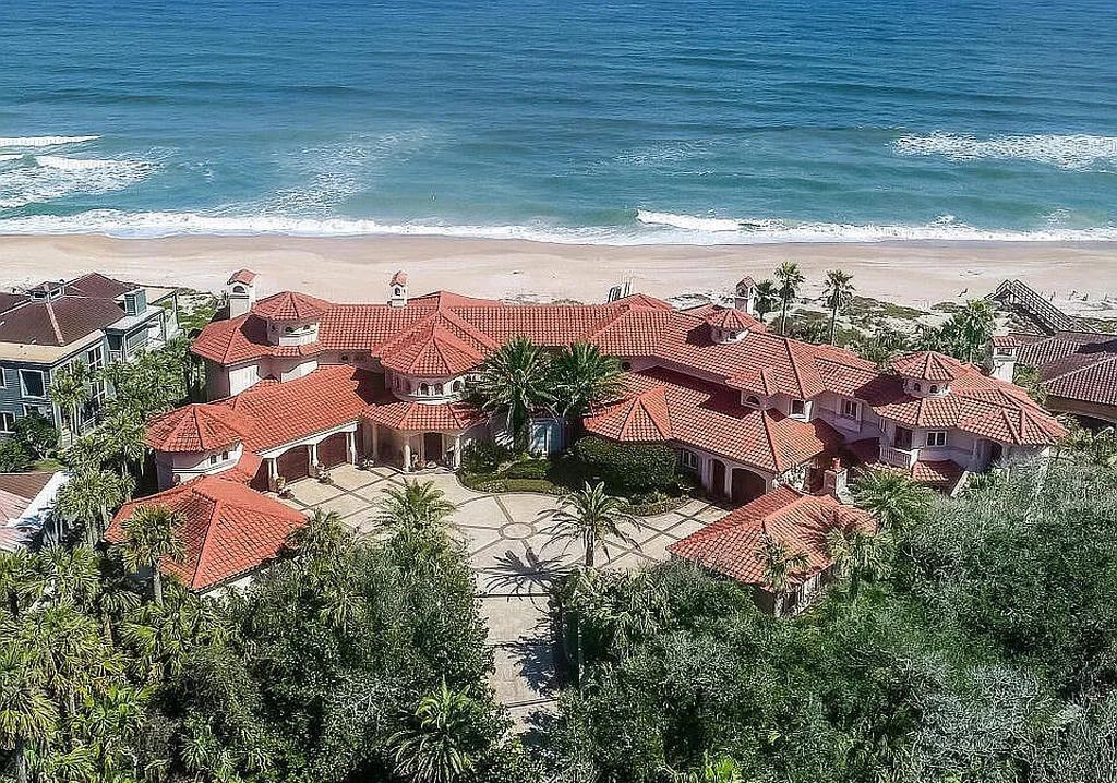 Step into the epitome of coastal luxury at 1263 Ponte Vedra Blvd, an awe-inspiring custom estate in Ponte Vedra Beach. Perched on a high bluff with 200' of ocean-frontage, this 12,751-square-foot sanctuary boasts 6 ensuite bedrooms, 7 full and 3 half baths, a media room, elevator, and a wine cellar for 2200 bottles.