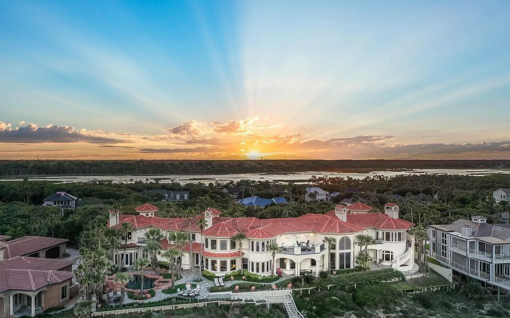 Step into the epitome of coastal luxury at 1263 Ponte Vedra Blvd, an awe-inspiring custom estate in Ponte Vedra Beach. Perched on a high bluff with 200' of ocean-frontage, this 12,751-square-foot sanctuary boasts 6 ensuite bedrooms, 7 full and 3 half baths, a media room, elevator, and a wine cellar for 2200 bottles.