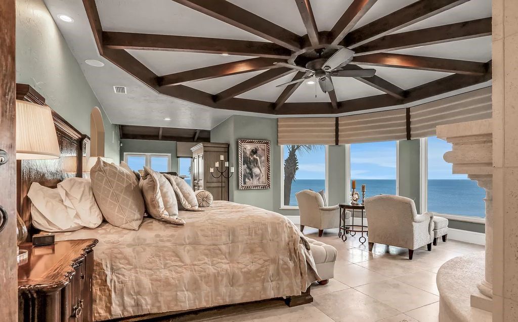 Step into the epitome of coastal luxury at 1263 Ponte Vedra Blvd, an awe-inspiring custom estate in Ponte Vedra Beach. Perched on a high bluff with 200' of ocean-frontage, this 12,751-square-foot sanctuary boasts 6 ensuite bedrooms, 7 full and 3 half baths, a media room, elevator, and a wine cellar for 2200 bottles.