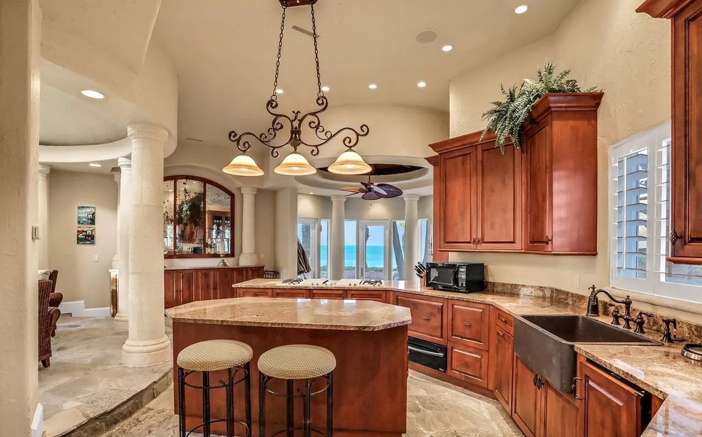 Step into the epitome of coastal luxury at 1263 Ponte Vedra Blvd, an awe-inspiring custom estate in Ponte Vedra Beach. Perched on a high bluff with 200' of ocean-frontage, this 12,751-square-foot sanctuary boasts 6 ensuite bedrooms, 7 full and 3 half baths, a media room, elevator, and a wine cellar for 2200 bottles.