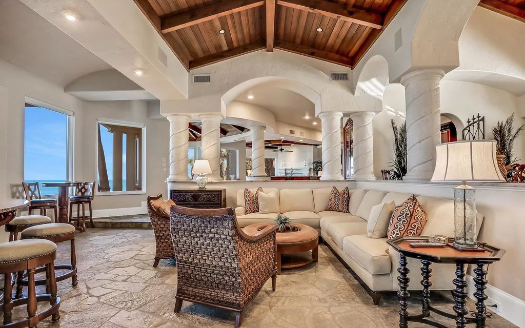 Step into the epitome of coastal luxury at 1263 Ponte Vedra Blvd, an awe-inspiring custom estate in Ponte Vedra Beach. Perched on a high bluff with 200' of ocean-frontage, this 12,751-square-foot sanctuary boasts 6 ensuite bedrooms, 7 full and 3 half baths, a media room, elevator, and a wine cellar for 2200 bottles.