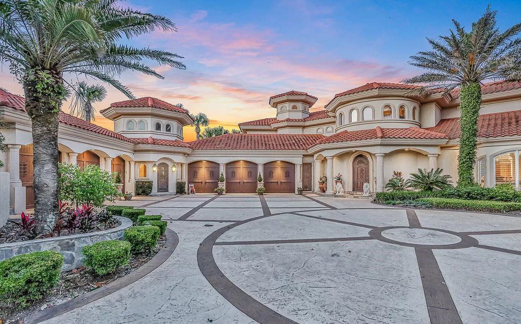 Step into the epitome of coastal luxury at 1263 Ponte Vedra Blvd, an awe-inspiring custom estate in Ponte Vedra Beach. Perched on a high bluff with 200' of ocean-frontage, this 12,751-square-foot sanctuary boasts 6 ensuite bedrooms, 7 full and 3 half baths, a media room, elevator, and a wine cellar for 2200 bottles.